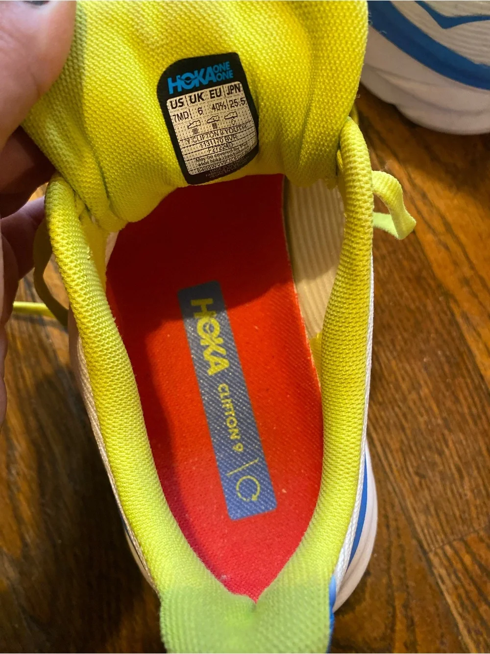 Hoka White Athletic Shoes with Blue Gradient and Neon Yellow Laces